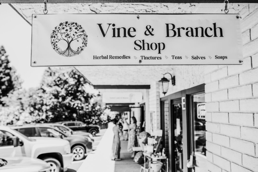 vine and branch shop outside black and white shop sign