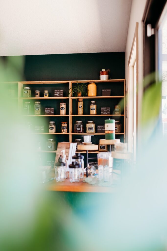 Bulk herbs on wall behind counter